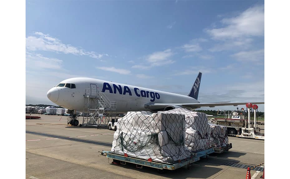 Cargo covered with plastic sheets.