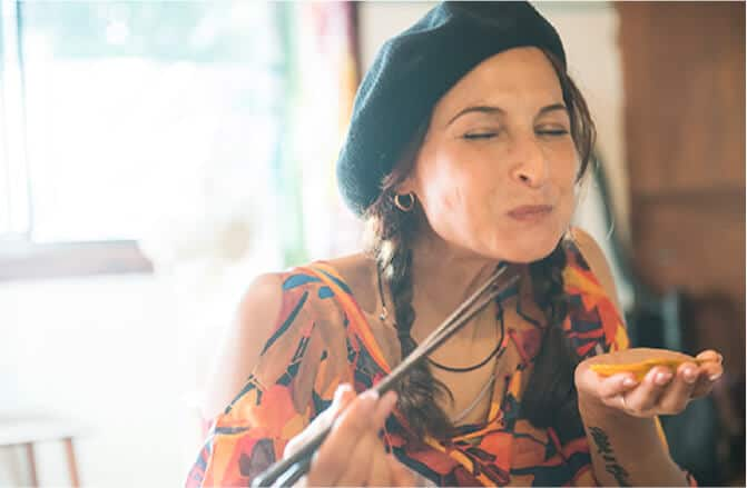 A woman eating Hiougigai