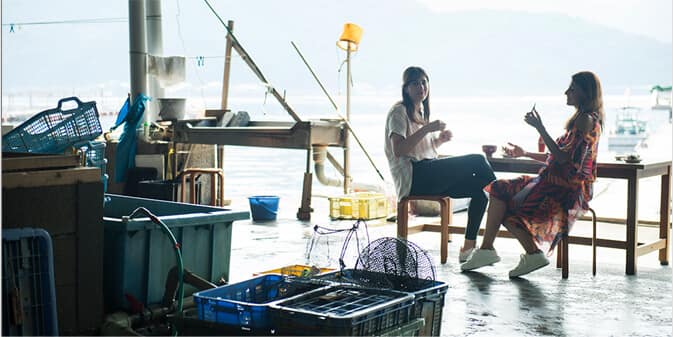 Two women are eating in Maruni Fisheries