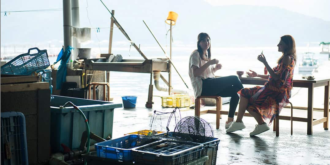 Two women are eating in Maruni Fisheries