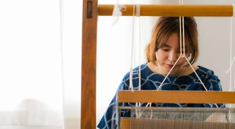 Craftsman using traditional loom