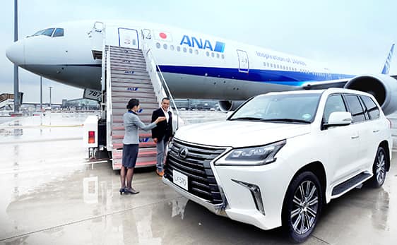 Ground staff greeting passenger upon their arrival